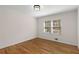Bedroom with hardwood floors, two windows and neutral colored walls at 2542 Maclaren Cir, Dunwoody, GA 30360