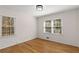 Bedroom with hardwood floors and two windows for natural light at 2542 Maclaren Cir, Dunwoody, GA 30360