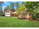 Charming two-story home with a well-manicured lawn and mature trees at 2542 Maclaren Cir, Dunwoody, GA 30360