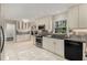 Modern kitchen features white cabinets, tile backsplash, stainless steel appliances, and a large window at 2542 Maclaren Cir, Dunwoody, GA 30360