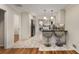 Bright kitchen features marble floors, stainless steel appliances and a breakfast bar with pendant lights at 2542 Maclaren Cir, Dunwoody, GA 30360