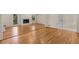 Spacious living room featuring hardwood floors, fireplace, and ample natural light perfect for gatherings at 2542 Maclaren Cir, Dunwoody, GA 30360