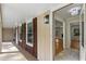Inviting porch with stylish lighting fixtures and a view into the home's interior at 2542 Maclaren Cir, Dunwoody, GA 30360