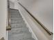 Carpeted stairway with wooden handrail at 2542 Maclaren Cir, Dunwoody, GA 30360