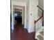 Open foyer with hardwood floors, staircase, and views into the dining and living spaces at 2555 Flat Shoals Rd # 2006, Atlanta, GA 30349