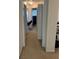 Upstairs hallway with carpeting and connecting doors at 2555 Flat Shoals Rd # 2006, Atlanta, GA 30349