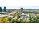 Scenic aerial view showcasing the lush green landscape and the vibrant cityscape in the background at 795 Hammond Dr # 813, Sandy Springs, GA 30328