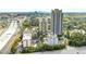 Aerial view showcasing the buildings in the community, surrounding greenery, and highway access at 795 Hammond Dr # 813, Sandy Springs, GA 30328