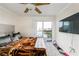 Cozy bedroom with balcony access, plush bedding, and mounted television at 795 Hammond Dr # 813, Sandy Springs, GA 30328