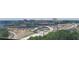 Scenic city view from above the tree line with highways, bridges, and skyscrapers in the distance at 795 Hammond Dr # 813, Sandy Springs, GA 30328