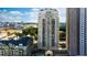 A full exterior view of a high rise condo building with many balconies and windows on a sunny day at 795 Hammond Dr # 813, Sandy Springs, GA 30328