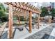 Outdoor grilling area featuring a built-in grill, countertop space, and shaded pergola at 795 Hammond Dr # 813, Sandy Springs, GA 30328