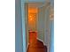 Hallway with hardwood floors, accented with artistic lighting and modern decor at 795 Hammond Dr # 813, Sandy Springs, GA 30328