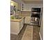 Well-lit kitchen with stainless steel appliances and ample counter space at 795 Hammond Dr # 813, Sandy Springs, GA 30328