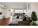 Cozy living room with a large sectional couch, modern decor, and balcony access, showcasing a relaxing space at 795 Hammond Dr # 813, Sandy Springs, GA 30328