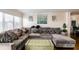 Inviting living room with a large sectional couch with decorative pillows, and bright natural light at 795 Hammond Dr # 813, Sandy Springs, GA 30328