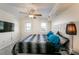 Well-lit primary bedroom with a large bed, modern lighting fixture, and ample space for relaxation at 795 Hammond Dr # 813, Sandy Springs, GA 30328