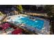Inviting pool area surrounded by lounge chairs, umbrellas, and lush landscaping for relaxation and recreation at 795 Hammond Dr # 813, Sandy Springs, GA 30328