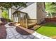 Townhome backyard with a deck, privacy fence, manicured landscaping, and patio at 11894 Aspen Forest Dr, Johns Creek, GA 30005