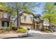 Attractive two-story home featuring an attached garage, well-manicured lawn, and inviting curb appeal at 11894 Aspen Forest Dr, Johns Creek, GA 30005