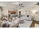 Open-concept living room flowing into the kitchen with hardwood floors and lots of natural light at 11894 Aspen Forest Dr, Johns Creek, GA 30005