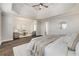 Spacious main bedroom features sitting area, hardwood floors, and neutral decor at 11894 Aspen Forest Dr, Johns Creek, GA 30005