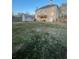 Wide shot of the backyard featuring a storage shed, lawn and a two story home at 2532 Greenes Ln, Powder Springs, GA 30127