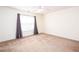 Bright bedroom features neutral carpet, a ceiling fan, and a window with light-filtering blinds and draperies at 269 Cottonwood Creek Cir, Canton, GA 30114