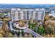 Gorgeous aerial view of highrise, highlighting the lush landscaping and winding entrance at 2950 Mount Wilkinson Se Pkwy # 505, Atlanta, GA 30339