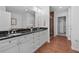 Bathroom with double vanity, granite countertop, and tiled floor leading to a shower at 2950 Mount Wilkinson Se Pkwy # 505, Atlanta, GA 30339