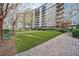 Well-maintained outdoor common area with brick walkways, manicured lawn, and seating at 2950 Mount Wilkinson Se Pkwy # 505, Atlanta, GA 30339