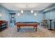 Entertaining game room with a classic billiards table and ambient lighting at 2950 Mount Wilkinson Se Pkwy # 505, Atlanta, GA 30339