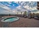Outdoor hot tub with brick surround, lounge chairs, and city views in the background at 2950 Mount Wilkinson Se Pkwy # 505, Atlanta, GA 30339