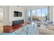 Cozy living area featuring modern furniture, wood floors, and a sliding door to balcony perfect for relaxing at 2950 Mount Wilkinson Se Pkwy # 505, Atlanta, GA 30339
