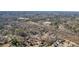 Aerial view of a home in a wooded residential neighborhood near a school at 1750 Latour Ne Dr, Marietta, GA 30066