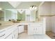 Bathroom featuring double sinks, a large mirror, and a tiled shower at 1750 Latour Ne Dr, Marietta, GA 30066