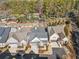 An aerial view of gray roofed homes with landscaping in the Enclave at Wiley Bridge community at 105 Ivey Way, Woodstock, GA 30188