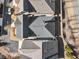An aerial view of grey roofed homes with small trees lining the street at 105 Ivey Way, Woodstock, GA 30188