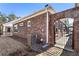 Brick exterior with gated access to a courtyard and well manicured lawn at 105 Ivey Way, Woodstock, GA 30188