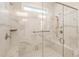 Modern bathroom features a glass enclosed shower with marble tiling, built-in bench, and dual shower heads at 105 Ivey Way, Woodstock, GA 30188