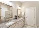 Modern bathroom with double vanity, granite counters, and walk-in shower at 105 Ivey Way, Woodstock, GA 30188