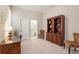 Spacious bedroom has an adjacent office nook with built-in shelves and decorative chairs and is freshly painted at 105 Ivey Way, Woodstock, GA 30188