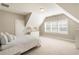 Bright bedroom with plush carpet, complemented by white shutters and a large dresser at 105 Ivey Way, Woodstock, GA 30188