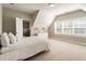 Inviting bedroom with bright windows, featuring a walk-in closet and neutral walls at 105 Ivey Way, Woodstock, GA 30188