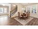 Dining room features a vaulted ceiling, wood floors, and is adjacent to the entry at 105 Ivey Way, Woodstock, GA 30188