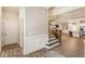 Open-concept entryway features hardwood flooring and leads to the staircase, kitchen and dining area at 105 Ivey Way, Woodstock, GA 30188