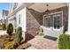 Close-up of brick and siding with double front door at 105 Ivey Way, Woodstock, GA 30188