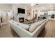 Spacious open concept living room and kitchen with hardwood floors, fireplace, and plenty of seating at 105 Ivey Way, Woodstock, GA 30188