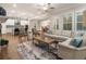 Bright open concept living room and kitchen with hardwood floors and plenty of natural light at 105 Ivey Way, Woodstock, GA 30188