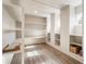 Custom shelving is installed in this room with white accents and hardwood floors at 105 Ivey Way, Woodstock, GA 30188